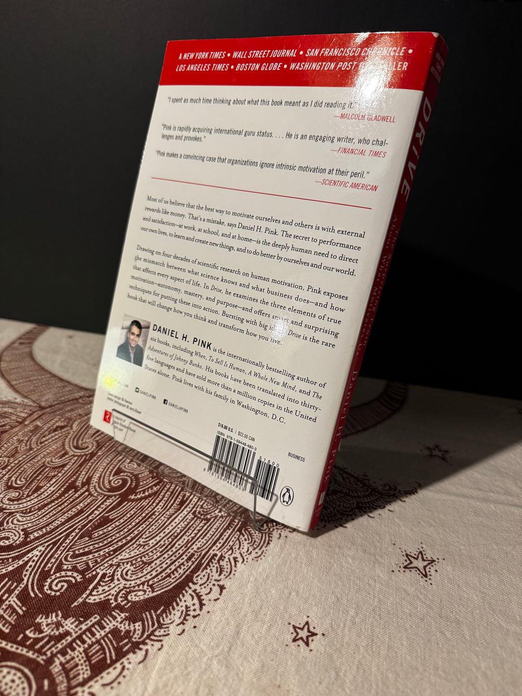 Back cover of a book titled 'Drive' on a patterned surface