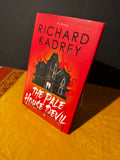 Book titled 'The Pale Devil' by Richard Kadrey on a yellow and black background