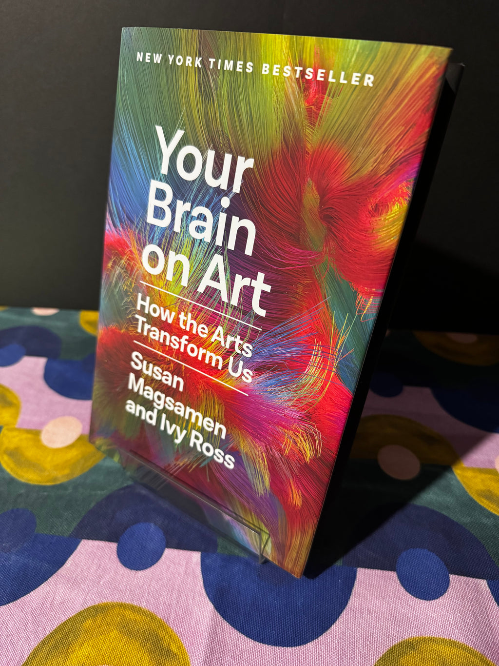 Book titled 'Your Brain on Art' on a colorful surface