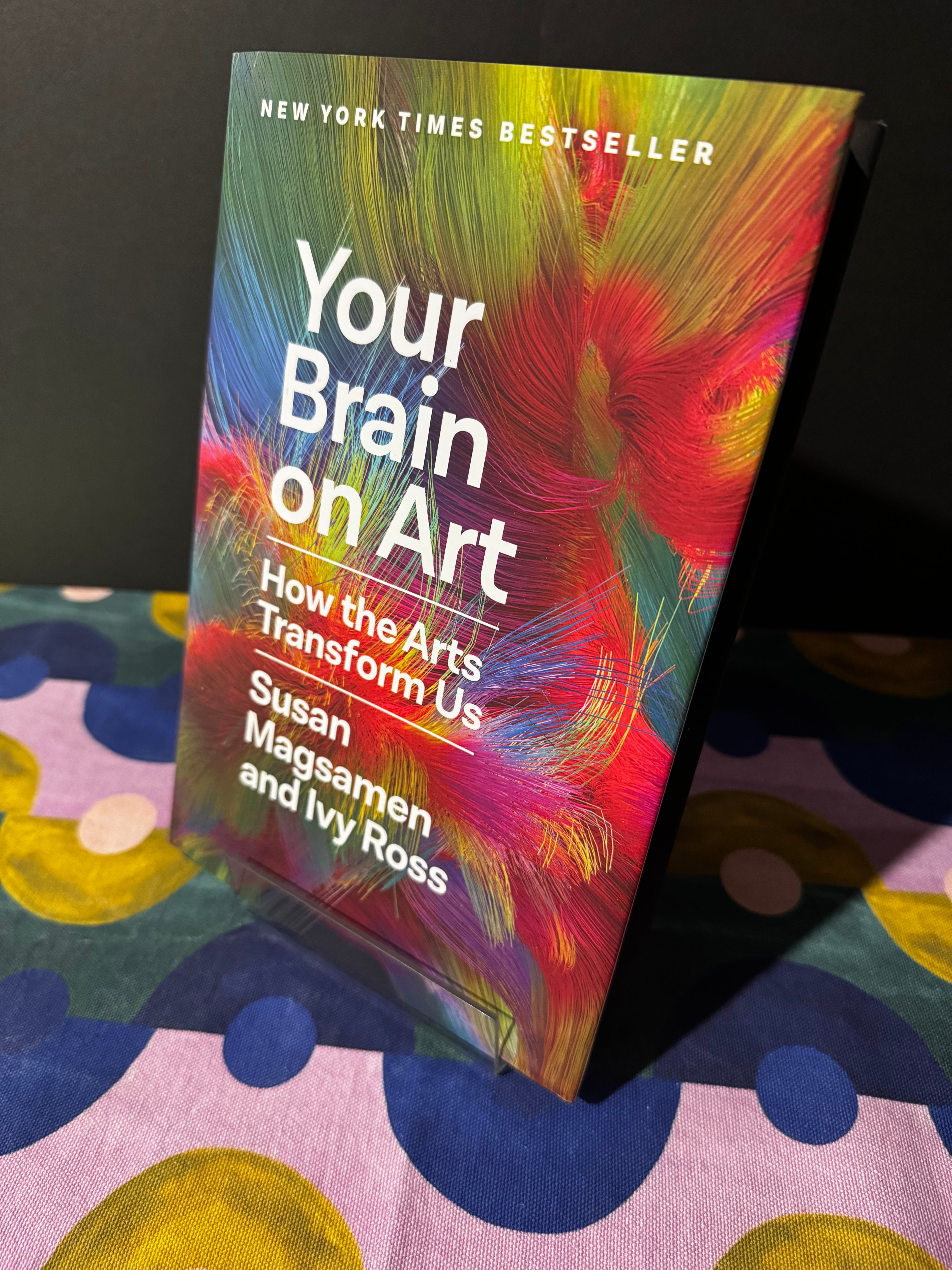 Book titled 'Your Brain on Art' on a colorful surface