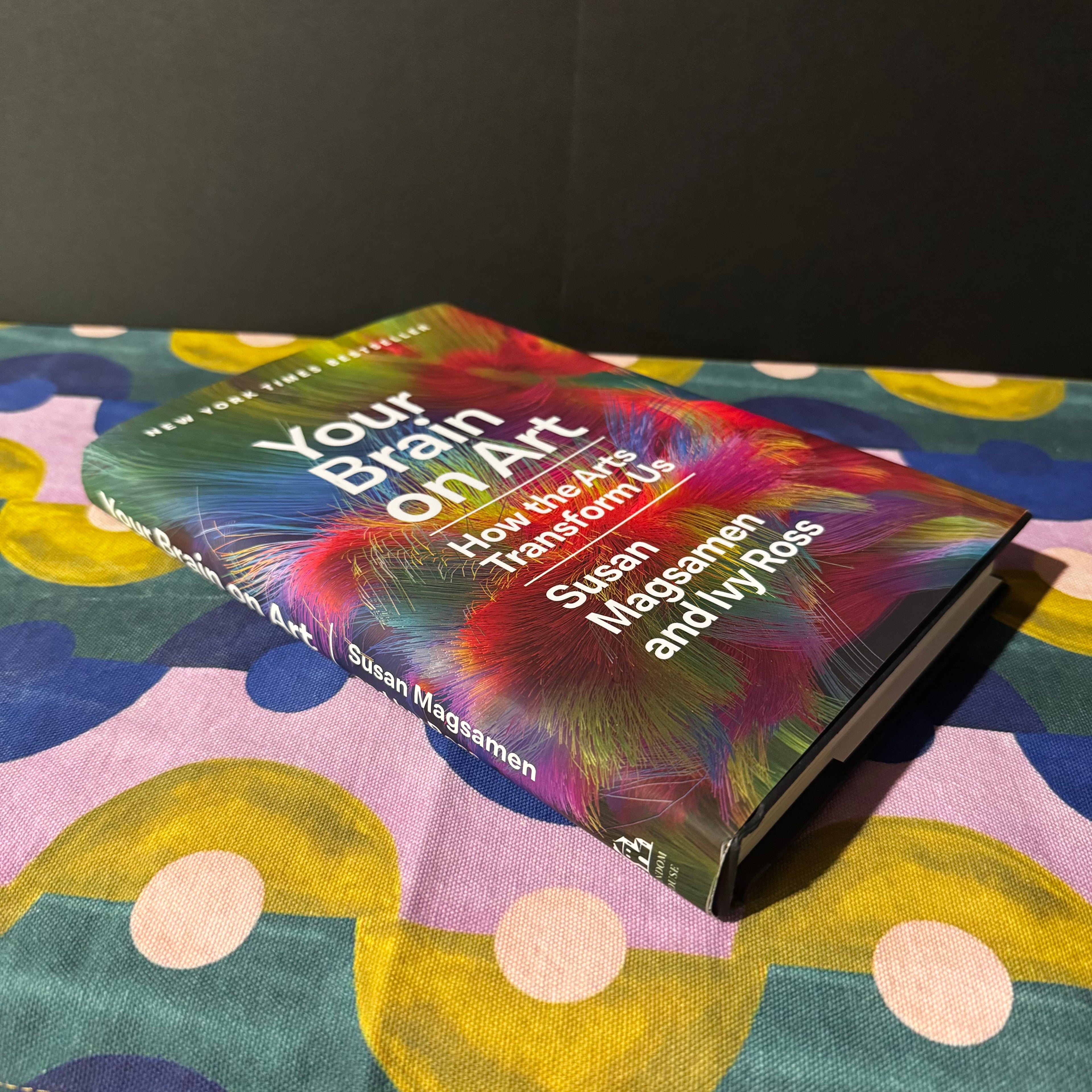 Book titled 'Your Brain on Art' on a colorful surface