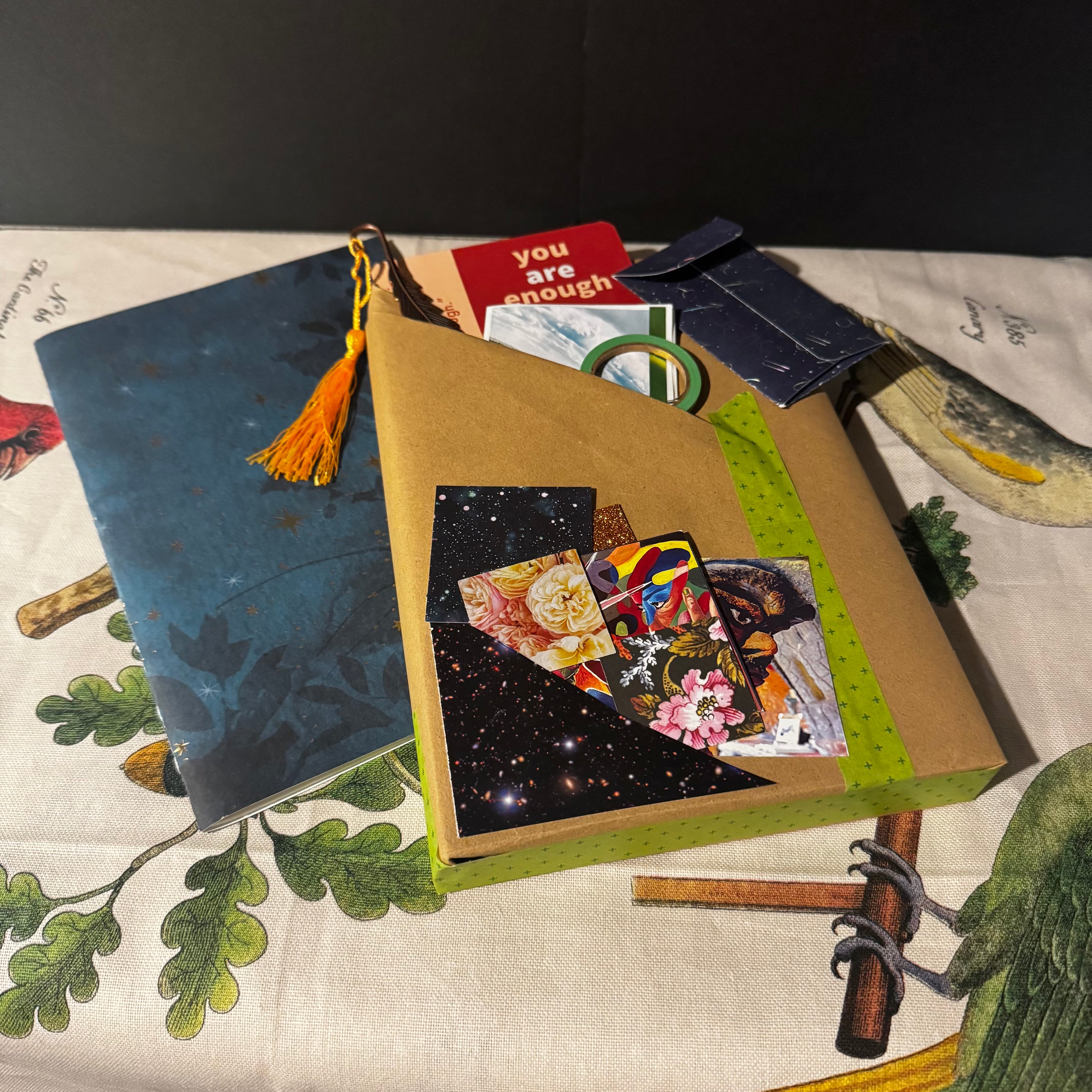 Artistic collage with books and cards on a textured surface