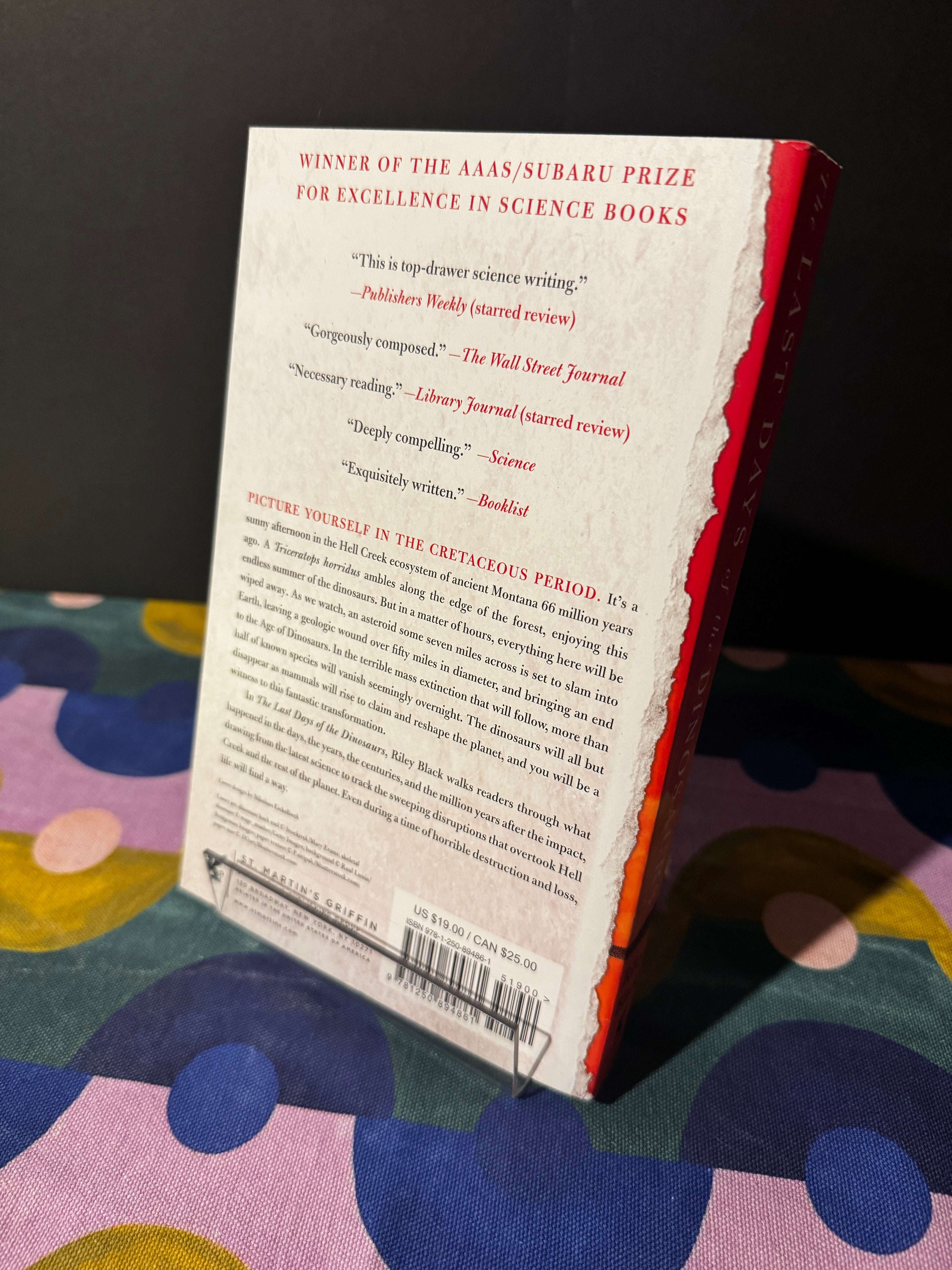 Book with a colorful polka dot pattern on a dark background