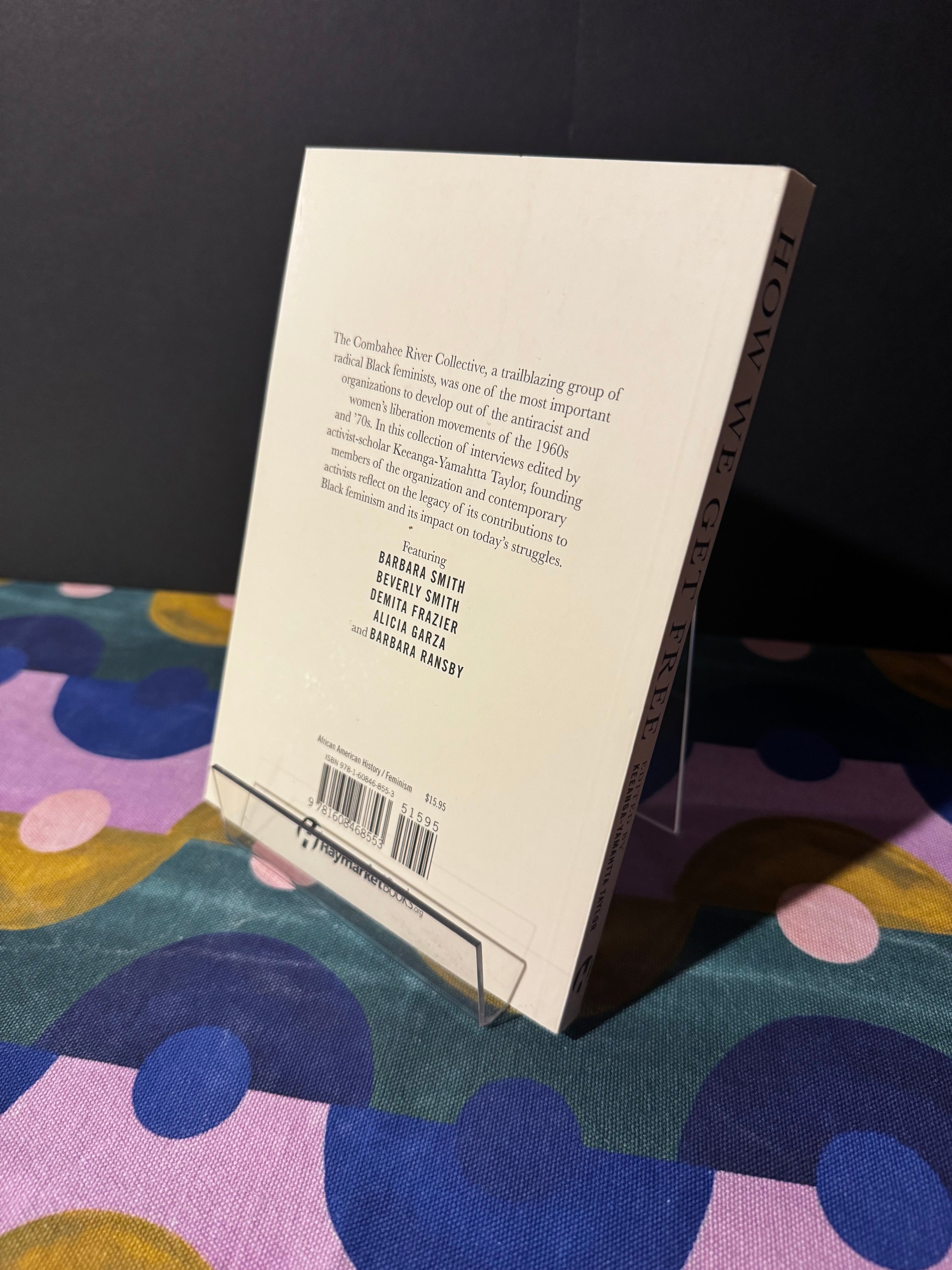 Book with a barcode on a colorful fabric background